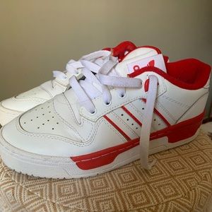 Red and white adidas sneakers